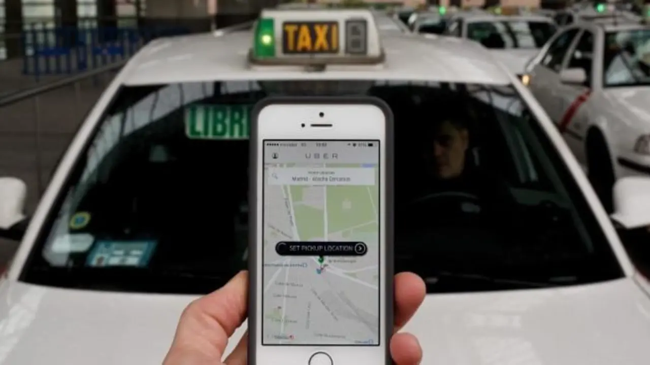 MADRID, SPAIN - OCTOBER 14:  In this photo illustration the new smart phone taxi app 'Uber' shows how to select a pick up location at Atocha Station on October 14, 2014 in Madrid, Spain. 'Uber' application started to operate in Madrid last September despite Taxi drivers claim it is an illegal activity and its drivers currently operate without a license. 'Uber' is an American based company which is quickly expanding to some of the main cities from around the world.  (Photo by Pablo Blazquez Dominguez/Getty Images)