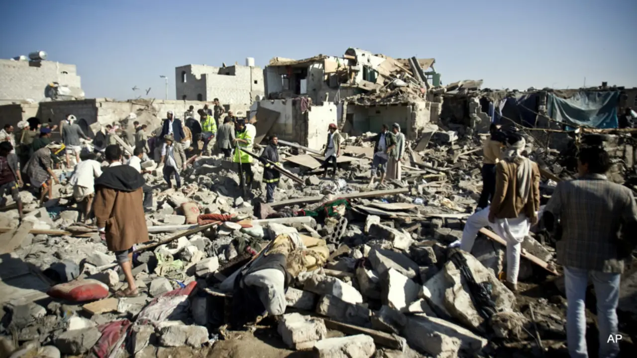 People search for survivors under the rubble of houses destroyed by Saudi airstrikes near Sanaa Airport, Yemen, Thursday, March 26, 2015. Saudi Arabia launched airstrikes Thursday targeting military installations in Yemen held by Shiite rebels who were taking over a key port city in the country's south and had driven the embattled president to flee by sea, security officials said. (AP Photo/Hani Mohammed)