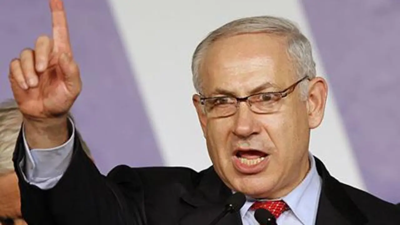 ** FILE ** In this Feb. 11, 2009 file photo, Israel's Likud Party leader Benjamin Netanyahu addresses supporters at the Likud election headquarters at the convention center in Tel Aviv. Far-right politician Avigdor Lieberman endorsed Benjamin Netanyahu for Israeli prime minister on Thursday, Feb. 19, 2009, all but guaranteeing that the U.S.-educated hawk will be the country's next leader. (AP Photo/Bernat Armangue, File)