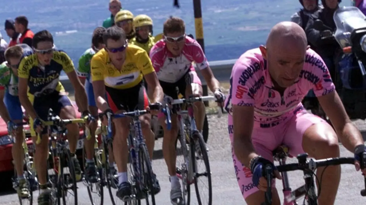 Marco Pantani of Italy, right, rides to victory ahead of Lance Armstrong, of Austin, Texas, left center wearing the yellow jersey, and Jan Ullrich of Germany, second from right, during the 12th stage of the Tour de France cycling race between Carpentras and Mont Ventoux, southern France, Thursday, July 13, 2000. (AP Photo/Pool/Patrick Boutroux)