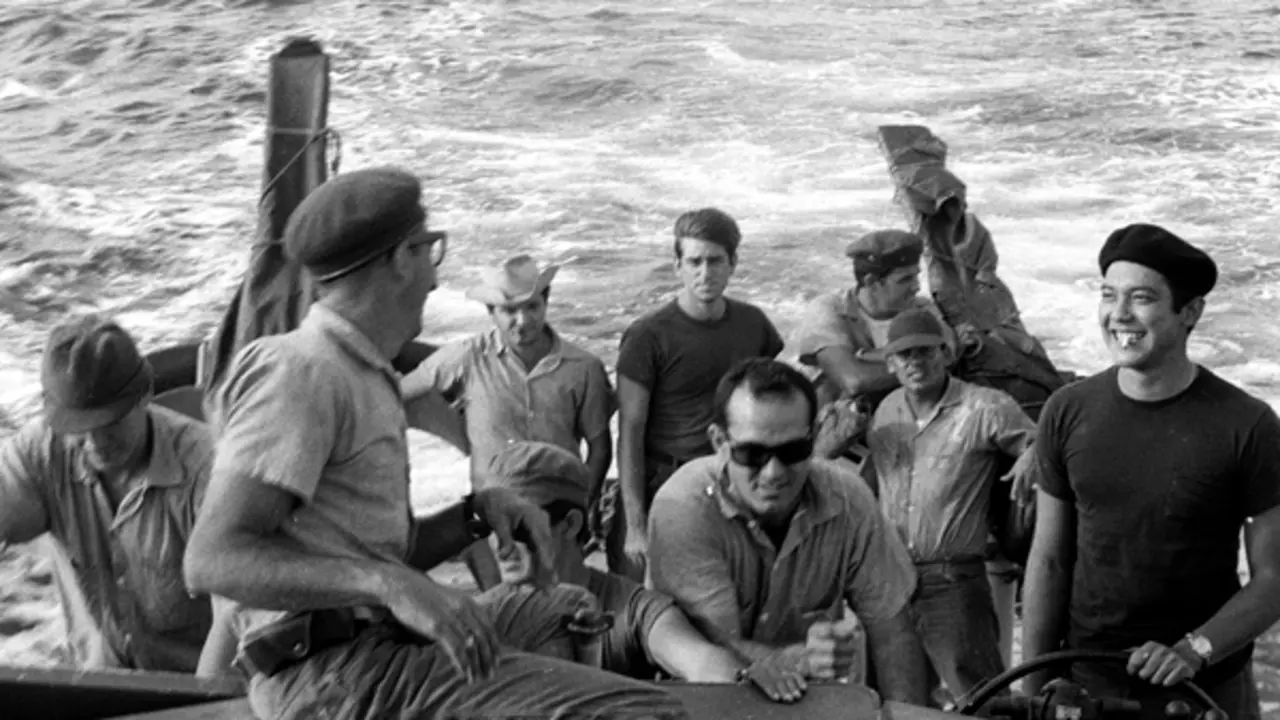 In this undated photo  22-years-old anti-Castro activist Santiago Alvarez, center with sun glasses, and his crew prepare for action, somewhere in Nicaragua, against Fidel Castro's government three years after the defeat of Cuban exiles in Bay of Pigs.  The failed Bay of Pigs invasion 50 years ago this weekend forever shaped the lives of the Cuban exiles sent by the U.S. to fight. (AP Photo/Jim Nickless)