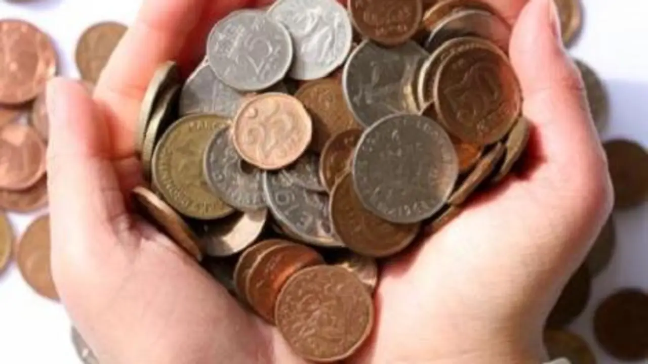 child holding   money in hands